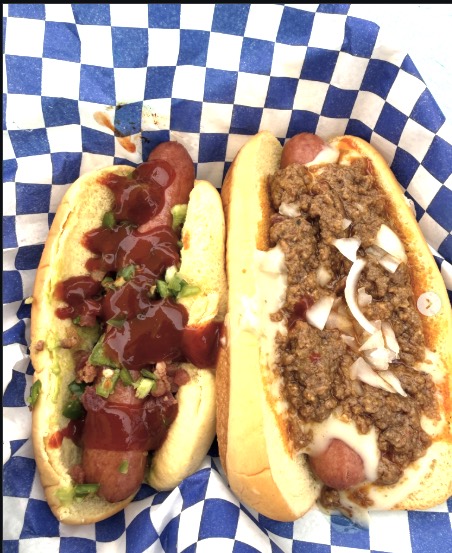 The ATX Dog and Chili Cheese Glizzy on checkered paper